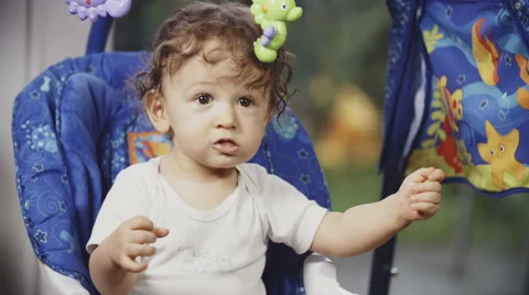 Cute Toddler on a Swing Stock Footage 49733285