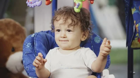 Cute Toddler on a Swing Видео 49733318