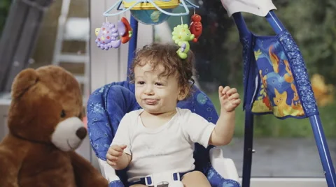 Cute Toddler on a Swing Stockbeeldmateriaal 49733987