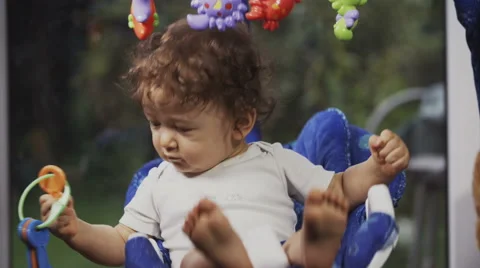 Cute Toddler on a Swing Stock Footage 49734041