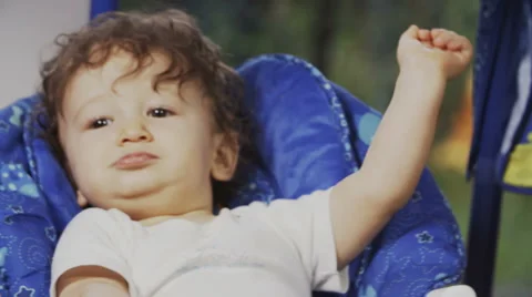 Cute Toddler on a Swing Vídeos de archivo 49734215