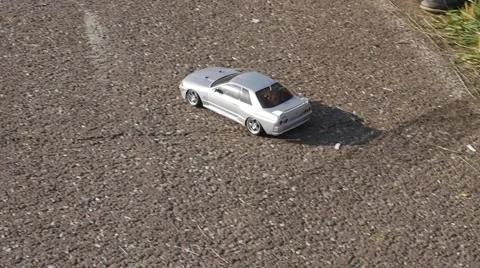 Cute toy remote control car drift on asphalt. Isolated. Stock Footage 52712540
