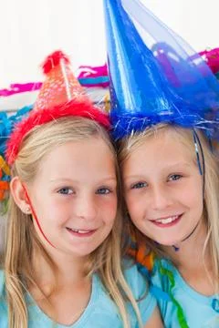 Cute twins during their birthday party Stock Photos
