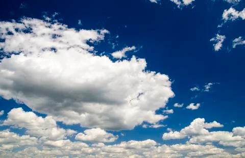 Cute white clouds in the sky background Stock Photos