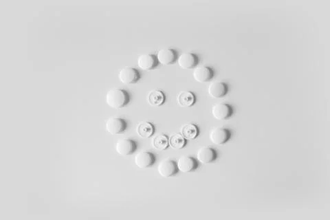 Cute white smiley on white background Stock Photos