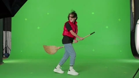 Cute Witch Flying on the green screen Stock Footage