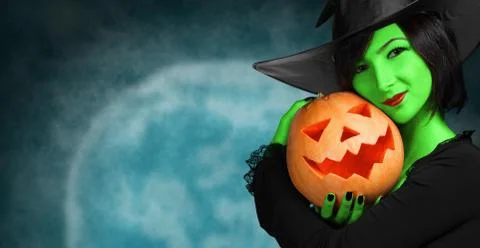 Cute witch with pumpkin Stock Photos