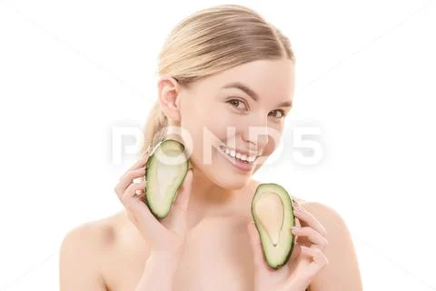The cute woman with an avocado on the white background Stock Photos