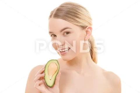 The cute woman with an avocado on the white background Stock Photos