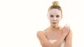 The cute woman with a clean face mask flirts on the white background 4k or 4k+ Resolution