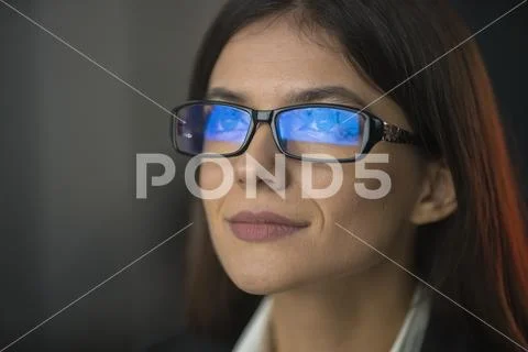 The cute woman in glasses Stock Photos