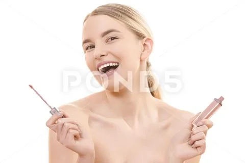 The cute woman holding a lip gloss on the white background Stock Photos