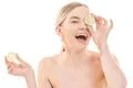 The cute woman with an open mouth and a lime on the white background Photo