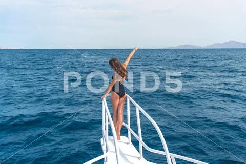 The cute woman pose on the yacht Stock Photos