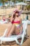 The cute woman rest on the beach Photo