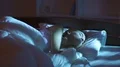 The cute woman sleeping on the bed. Evening night time 4k or 4k+ Resolution