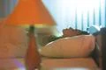 The cute woman sleeping on the bed Photo