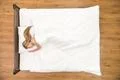 The cute woman sleeping on the bed. View from above Photo