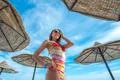 The cute woman stand in the beach on the sea background Photo