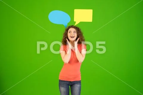 The cute woman stand with a dialog signs on the green background Stock Photos