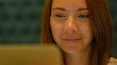 Cute woman using a notebook in a cafe Stock Footage 119039735