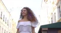 The cute woman walk on the street. Slow motion. Wide angle 4k or 4k+ Resolution