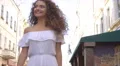 The cute woman walk on the street. Slow motion. Wide angle 4k or 4k+ Resolution