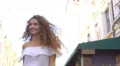 The cute woman walk on the street. Slow motion. Wide angle 4k or 4k+ Resolution