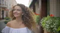 The cute woman walk on the street. Slow motion. Wide angle 4k or 4k+ Resolution