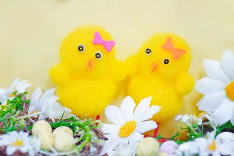 Cute yellow Easter chicks with Easter eggs Stock Photos