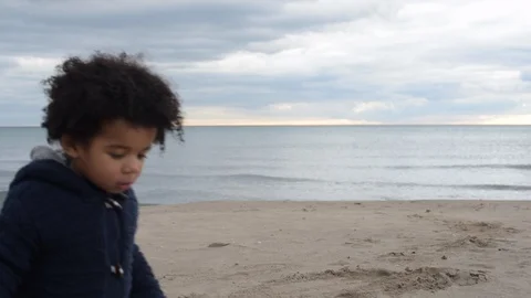 Cute young black boy running along beach Stock Footage 88958685