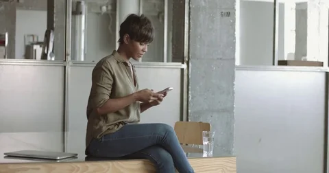 Cute young black woman in loft style office Stock Footage