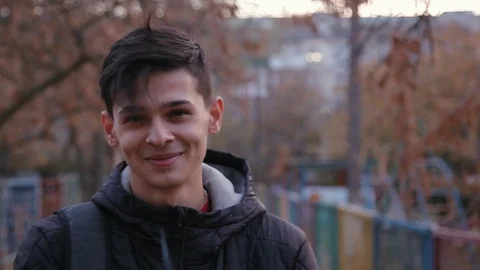 Cute young boy in 3D glasses standing on the outdoors, close up 動画素材 98359174