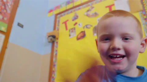 A cute young boy looks into the camera and smiles Stock Footage 34004940