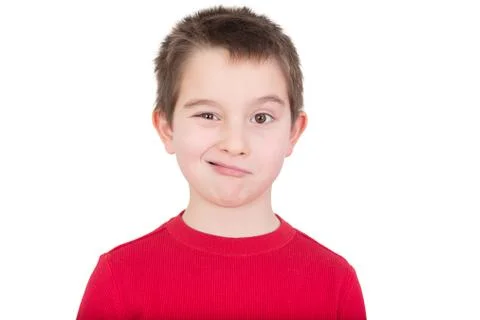 Cute young boy winking at the camera Stock Photos