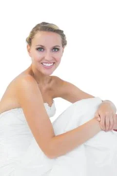 Cute young bride sitting on floor Stock Photos