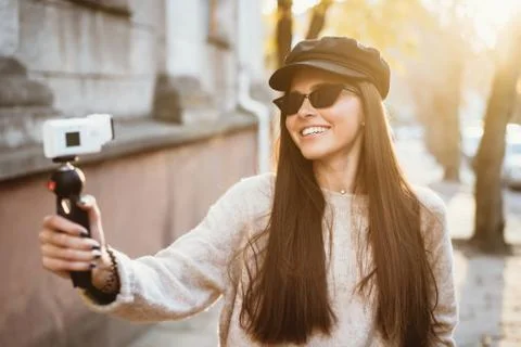 Cute, young female blogger posing on camera. Stock-Fotos