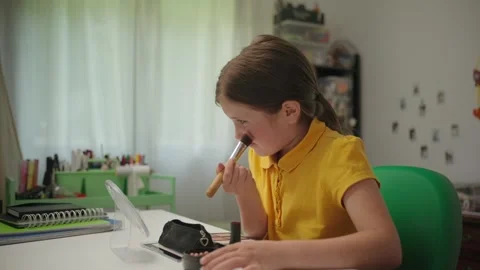 Cute Young Girl Applying Makeup at Her Desk Stock Footage 336618361