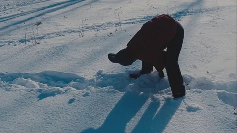 Cute young hipster couple having fun in winter park on a bright day hugging each Stock Footage 72409324