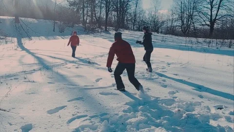 Cute young hipster couple having fun in winter park on a bright day hugging each 動画素材 72410017