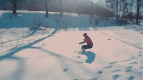 Cute young hipster couple having fun in winter park on a bright day hugging each Stock Footage 72410421