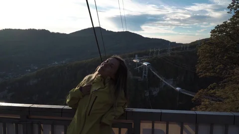 Cute young lady looking to the camera friendly on the front of autumn trees Video stock 107917853