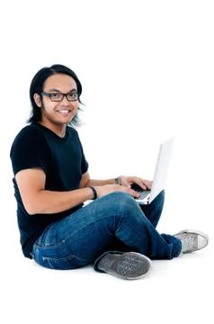 Cute Young Man Using Laptop Stock Photos