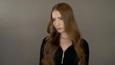 Cute young model poses for the camera Stock Footage 99703766