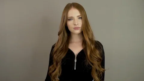 Cute young model poses for the camera Stock Footage 99717749