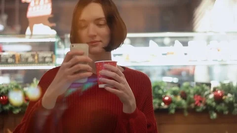 Cute young woman smiling using smartphone taking selfie sitting in cafe Video stock 83081259
