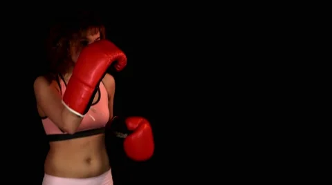 Cute young woman training with red boxing gloves Stock Footage 62344341
