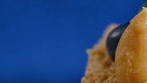 Cuted strawberry and blueberries on cake. The ignition spark on a children's Stock Footage