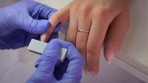 Cuticle removal with scissors macro Stock Footage 103830771