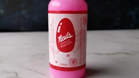 Cuticle Remover for Nails with Pink Liquid in a Bottle Stock Footage 240902999